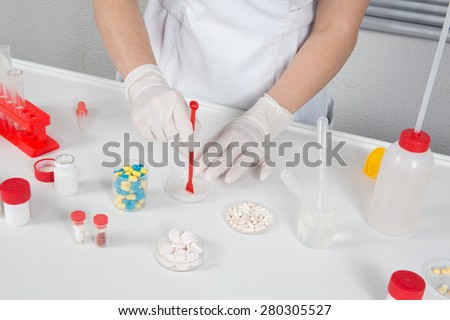 A happy scientist woman in the laboratory