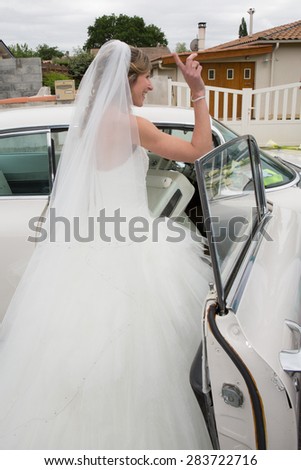 Beautiful bride on wedding car on her wedding day
