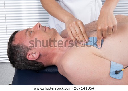 doing massage of electrostimulator Medical procedure.