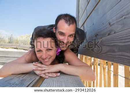 Wedding couple in love at the beach , piggy back