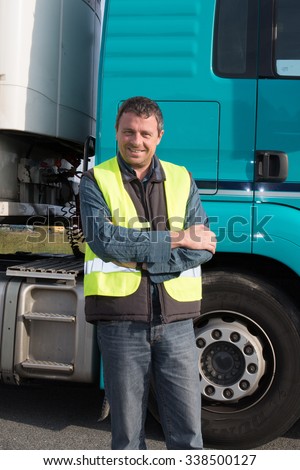 Serious and confident Man standing in front of truck