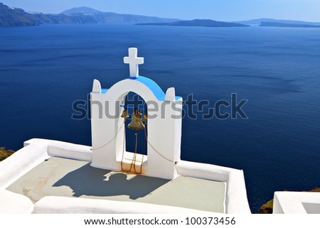 Traditional church and steeple at Oia village of Santorini island in Greece