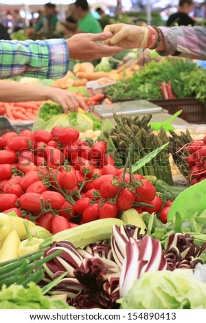 Italian plum tomatoes on lively farmers market