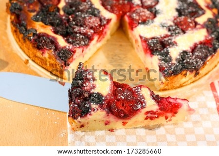 Piece of raspberry, blueberry and blackberry pie