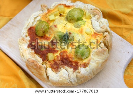 Vegetarian quiche with brussels sprout, potato, cheese, mascarpone and eggs, puff pastry