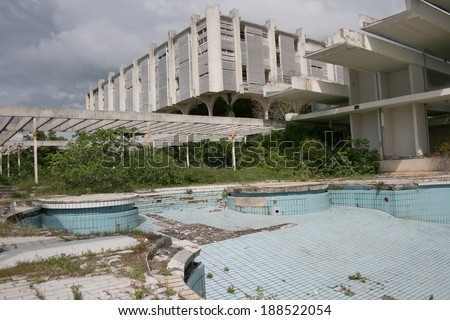 An abandoned five star hotel resort from 1970\'s with swimming pool decaying, poor management and finacial crisis