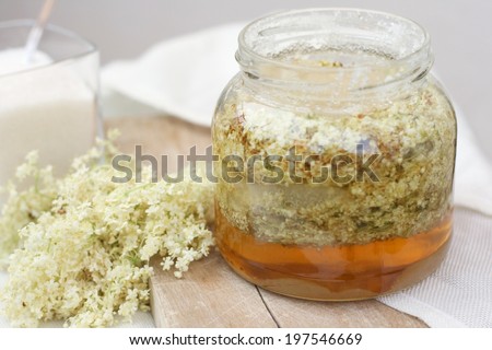 Making of french elderflower syrup, made out of fresh elderflower blossoms mixed with sugar