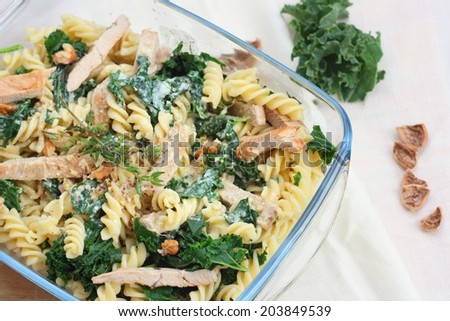 Kale or borecole recipe idea: pasta with walnut, cheese, sour cream, chicken meat and thyme, baked in owen