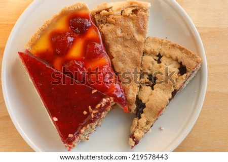 Different pieces of cake and pie on a plate, warm autumn colors, top view