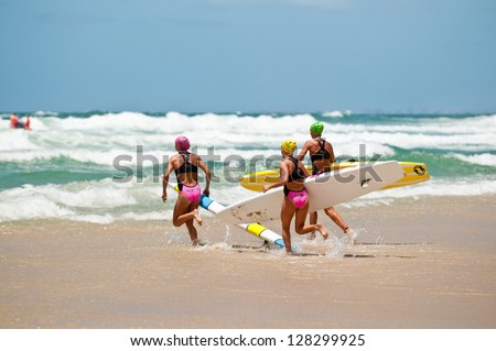 GOLD COAST, SURFERS PARADISE, QLD,  AUSTRALIA - FEB 9. 2013: J. Mercer (3) T. Coleman (16) compete on the round four of the Surf Ironwoman Series on February 09th 2013, Gold Coast Australia.