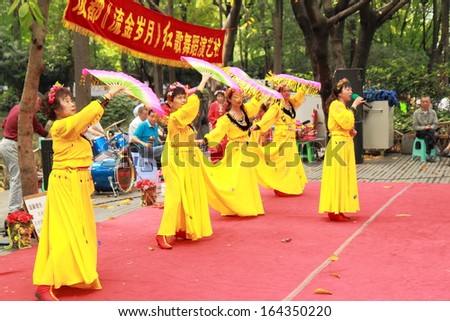 CHENGDU CHINA - May 04: Unidentified local dancers perform in People\'s park. May 04,2012 in Chengdu China. People\'s park provides a perfect point for people watching.