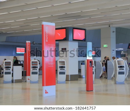 MELBOURNE AUSTRALIA - MARCH 14, 2014:Unidentified people queue at Melbourne Airport Qantas check in counter - Melbourne Airport is the primary airport serving of Melbourne and hub for Qantas airlines