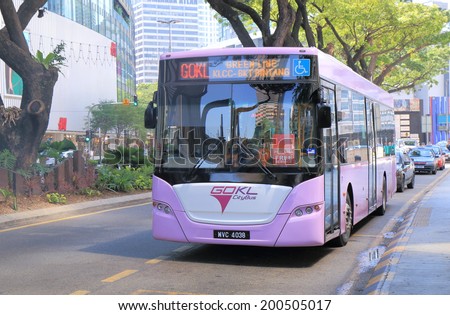 KUALA LUMPUR MALAYSIA - 25 May, 2014:Free public transport GOKL bus runs near Petronas tower. GOKL free bus was launched to improve public mobility in the area of KLCC, Bukit bin tang and china town.