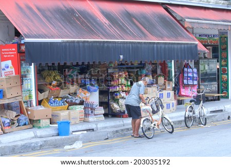 SINGAPORE - 27 May, 2014:Unidentified people shop at a grocery shop in Little India. Indian is the third largest ethnic group after Chinese and Malay in Singapore.