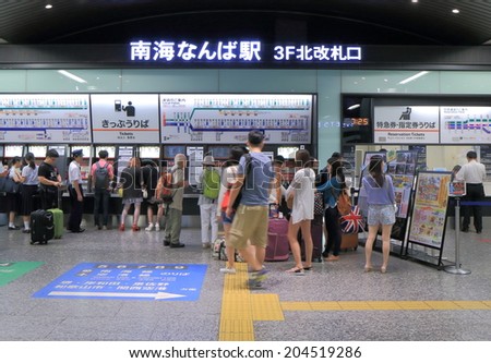 OSAKA JAPAN - 20 JUNE, 2014: Unidentified people queue to buy tickets at Nankai Nanba Station. Nankai Nanba Station is located in Nanba and connects downtown Osaka and Kansai airport for 35 mins.