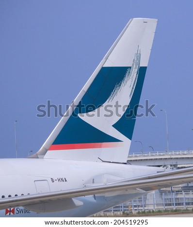OSAKA JAPAN - 20 JUNE, 2014: Cathay Pacific airplane at Kansai Airport.  Cathay Pacific is the de facto international flag carrier airline of Hong Kong.
