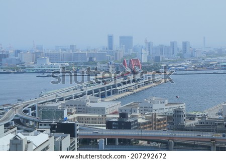 KOBE JAPAN - 2 JUNE, 2014: Port Island Kobe city view. Kobe is the sixth largest city in Japan and a cosmopolitan port city with Western cultural influence.