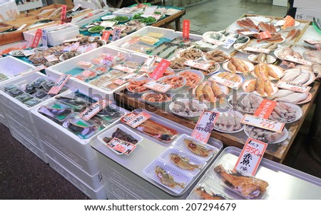 KANAZAWA JAPAN - 9 JUNE, 2014: Fish shop at Omicho market. Omichi market is the largest fresh food market and one of the most popular tourist destination in Kanazawa.