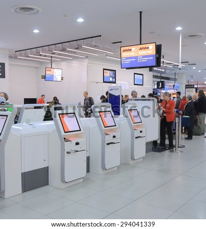 MELBOURNE AUSTRALIA - JUNE 18, 2015: Unidentified people check in at Jetstar check in counter at Melbourne airport. Qantas is the parent company of the low cost airline Jetstar