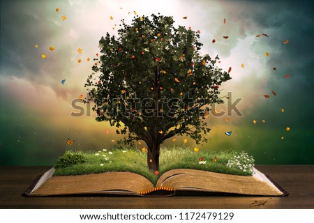 Tree with grass in a beautiful garden on an open book. Learning concept.