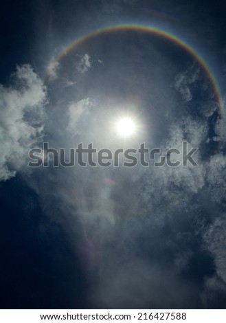 Solar corona with blue sky at noon.