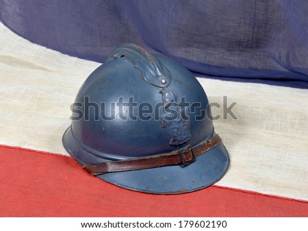 french Adrian WW1 helmet on the french antique flag