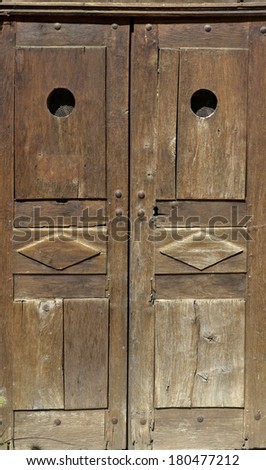 old wooden door of a Savoyard chapel