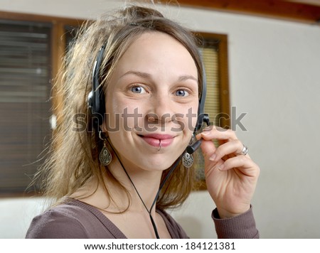 Woman with telephone headset on for customer service