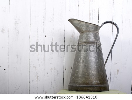 vintage pitcher on the white wall