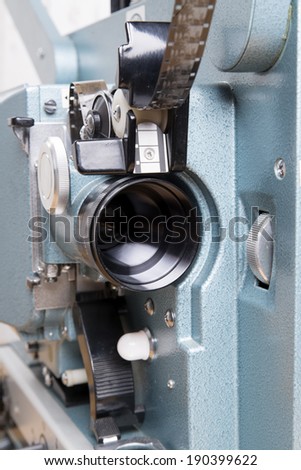 close up on the lens of a 16 mm film projector