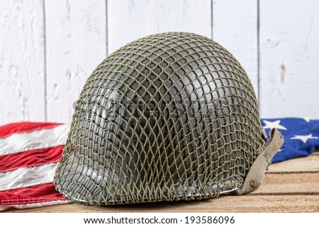 World War Two military helmet on an American Flag