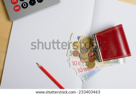 coin purse with money and notebook and pencil