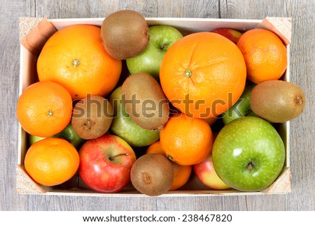 a small wooden crate with fruits