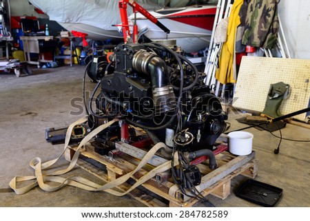 boat engine disassembled in a repair shop