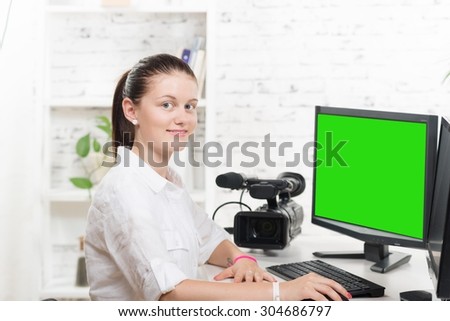 pretty young woman video editor with green screen