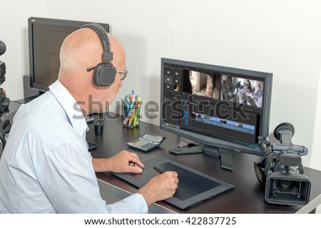 a video editor in his studio