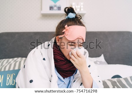 Young sick woman with cold and flu sneezing.  Seasonal influenza and virus. Healthcare concept