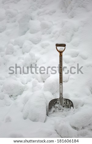 Shovel in a pile of snow