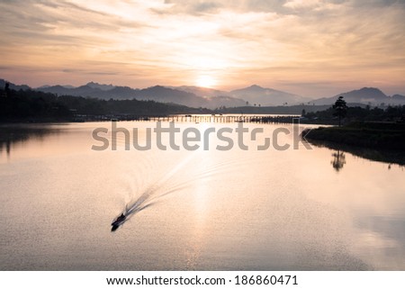 A boat and water flow line in the morning, Thailand