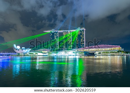 SINGAPORE - MAY 23: Marina Bay Sands hotel light show at night on May 23, 2015 in Singapore. It is the world\'s most expensive building with cost of US$ 4.7 billion and landmark of Singapore.