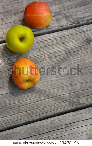 Three Apples on Wood