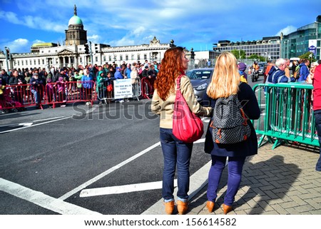 DUBLIN, IRELAND - SEPT 15: Unidentified spectators along Matt Talbot Bridge at the Dublin Air Festival in Dublin city centre on September 15, 2013 in Dublin, Ireland. 130,000 people attended.