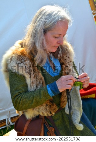 CLONTARF, IRELAND  APRIL 19: An unidentified Viking woman re-enactor attending the 1,000th anniversary re-enactment of the Battle of Clontarf on April 19, 2014 in Clontarf, Ireland.