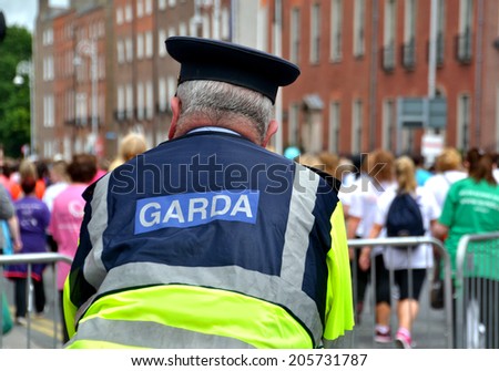 DUBLIN, IRELAND - JUNE 2: A Garda on foot duty at the start of The Dublin Women\'s Mini-Marathon on June 2, 2014 in Dublin, Ireland.