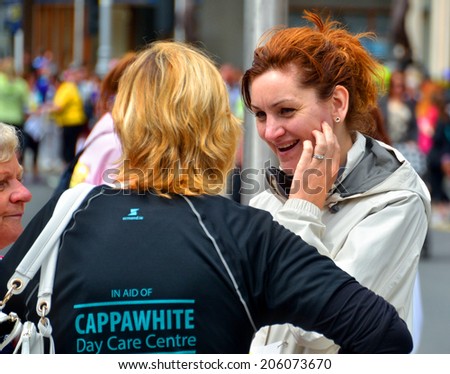 DUBLIN, IRELAND - JUNE 2: Charity participants at The Flora Dublin Women\'s Mini-Marathon at St. Stephen\'s Green on June 2, 2014 in Dublin, Ireland. Over 40,000 people attended the event.