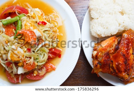 papaya salad with grilled chicken and sticky rice.