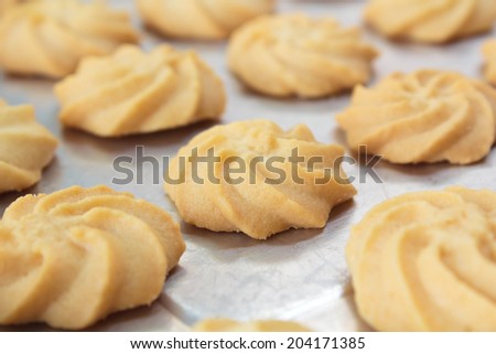 fresh homemade butter cookies on baking tray.