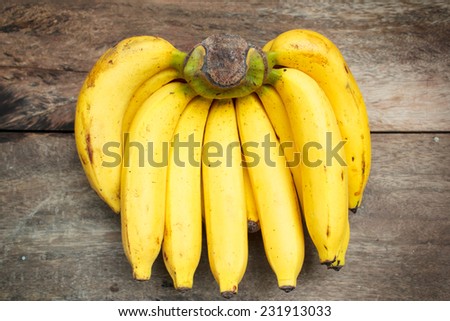 bunch of bananas on old wood, vintage style.