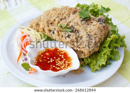 crispy catfish spicy salad and sweet sauce, Thai food.
