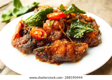phad phed pla duk thod krob (stir fried deep fried catfish with curry paste), thai food.